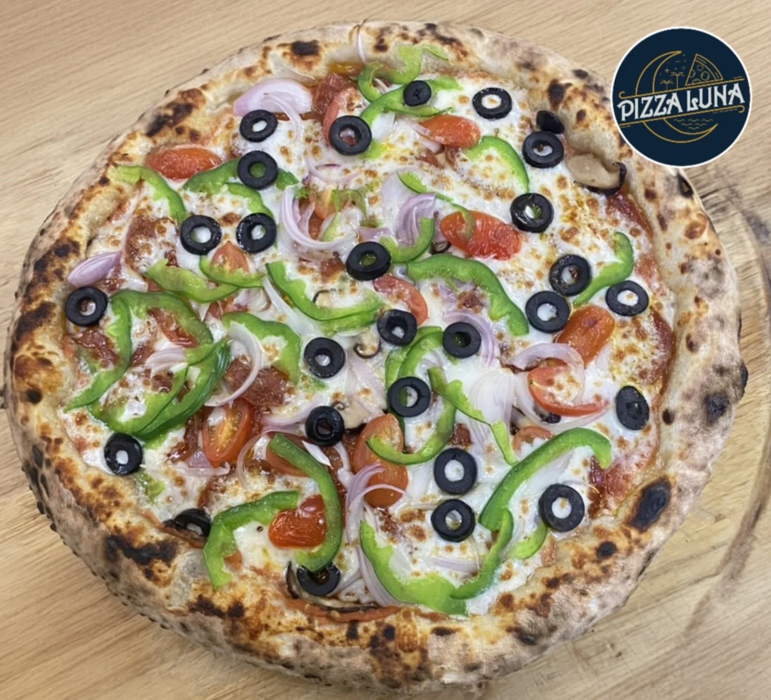 Fresh stone-oven pizza at Pizza Luna